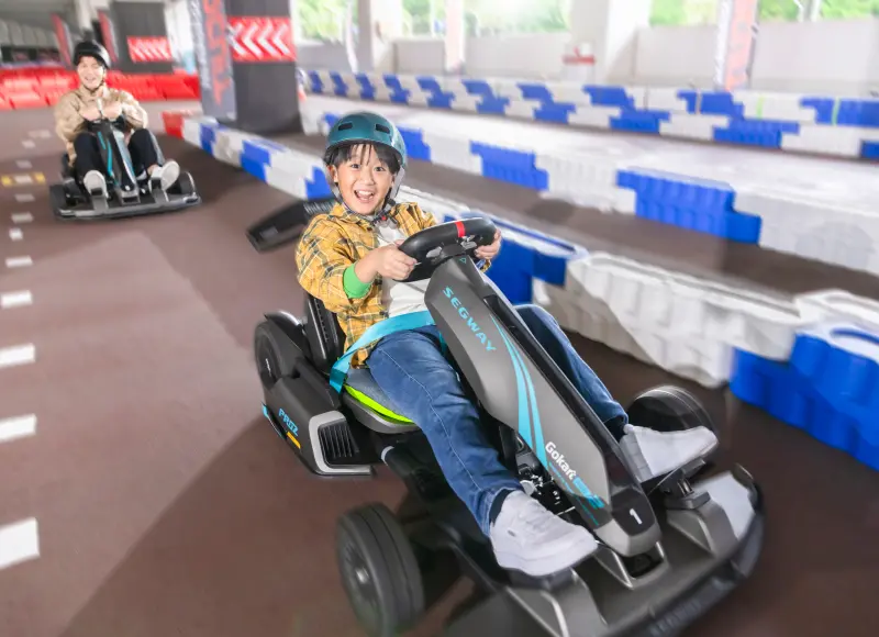 Children enjoying electric go-karts at SEAGAIA Circuit