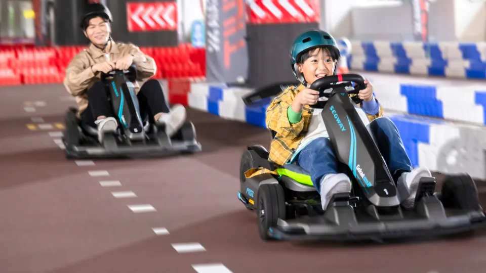 A parent and child enjoying go-karting at SEAGAIA Circuit