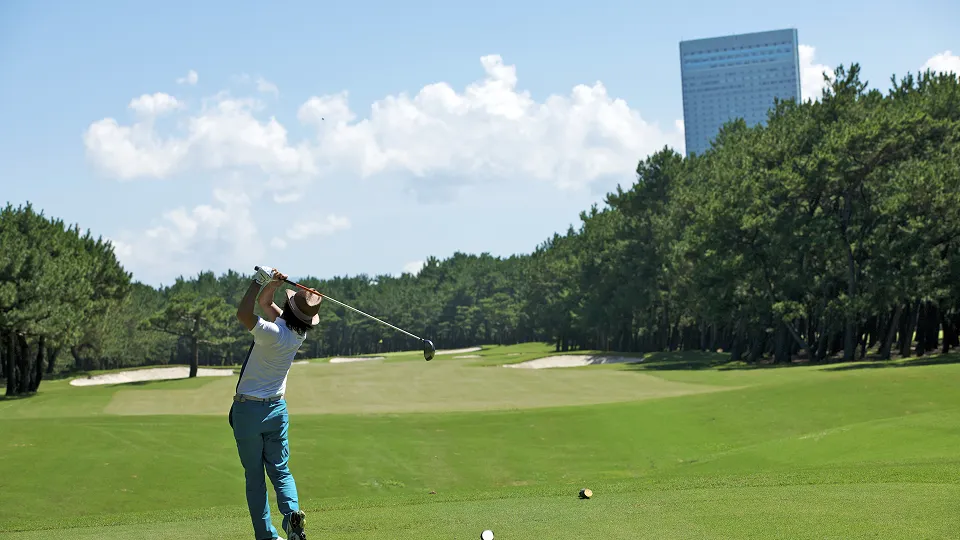 A person taking a shot on a golf course